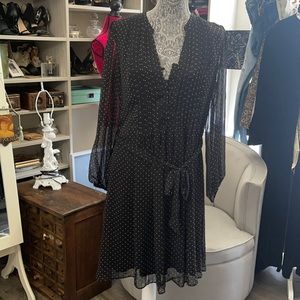 Women’s cute black dress with polka dots.